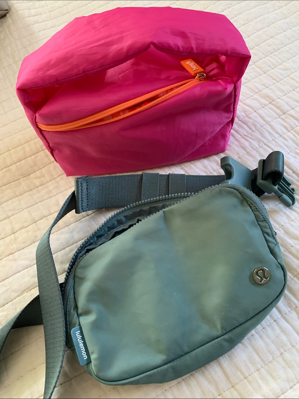 lululemon waist bag and pink cosmetic bag